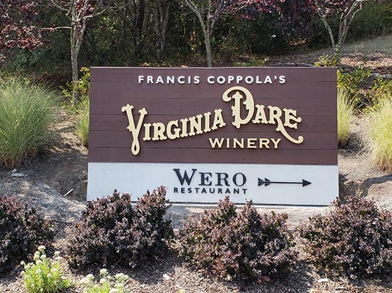 This sign is a re-purposed lighted cabinet left over from the last winery.  The surface is stained redwood and the copy is 3/4:" painted plex and 2" deep fabricated and auto painted aluminum letters.