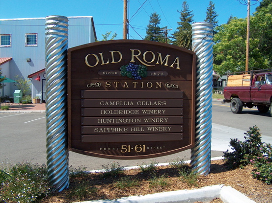 Old Roma 

redwood monument with 3D urathane letters covered in 23K gold leaf and carved grape cluster.  This sign is awesome and stands out 

wonderfully, the picture does it no justice