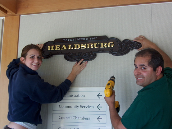 3d carved from urathane with a fauxed finished background and 23k gold leaf copy.  This sign was donated to the 

City of Healdsburg and hangs on a wall at the City Hall.  It is being installed by Mike and my daughter Erin