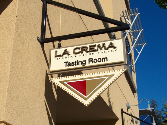 La Crema MDO plywood blade sign with 23K gold 2D letters and custom bracket