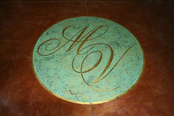 Floor logo with faux finish "copper look" 23K gold leaf letters 

& border, cleared with epoxy
