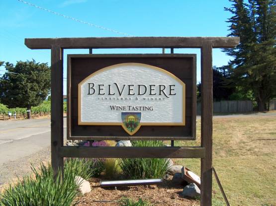 Belvedere hand carved urathane sign with distressed redwood posts and background panel.  This sign is a true 


