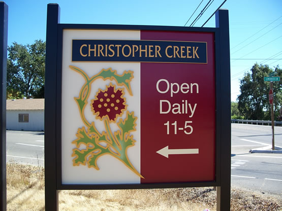 Christopher Creek is a MDO plywood sign with the logo & main copy panel in 1/2