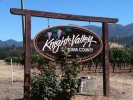 This sign is well over 10 years old at the time of this picture. It is sandblasted redwood with hand painted copy & graphic.