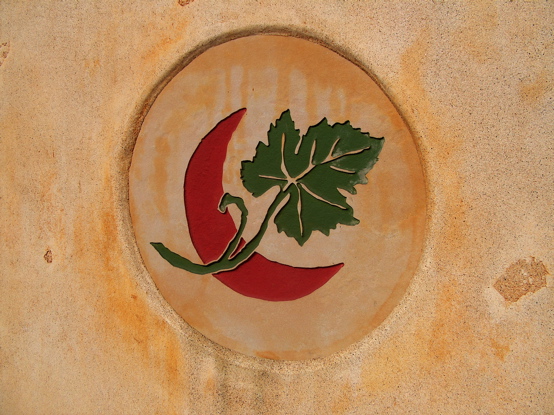 This logo was sand carved out of flagstone and mounted in a stucco monument