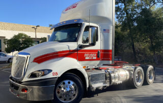 Peterbuilt truck with logo vinyl decals over red pinstriping